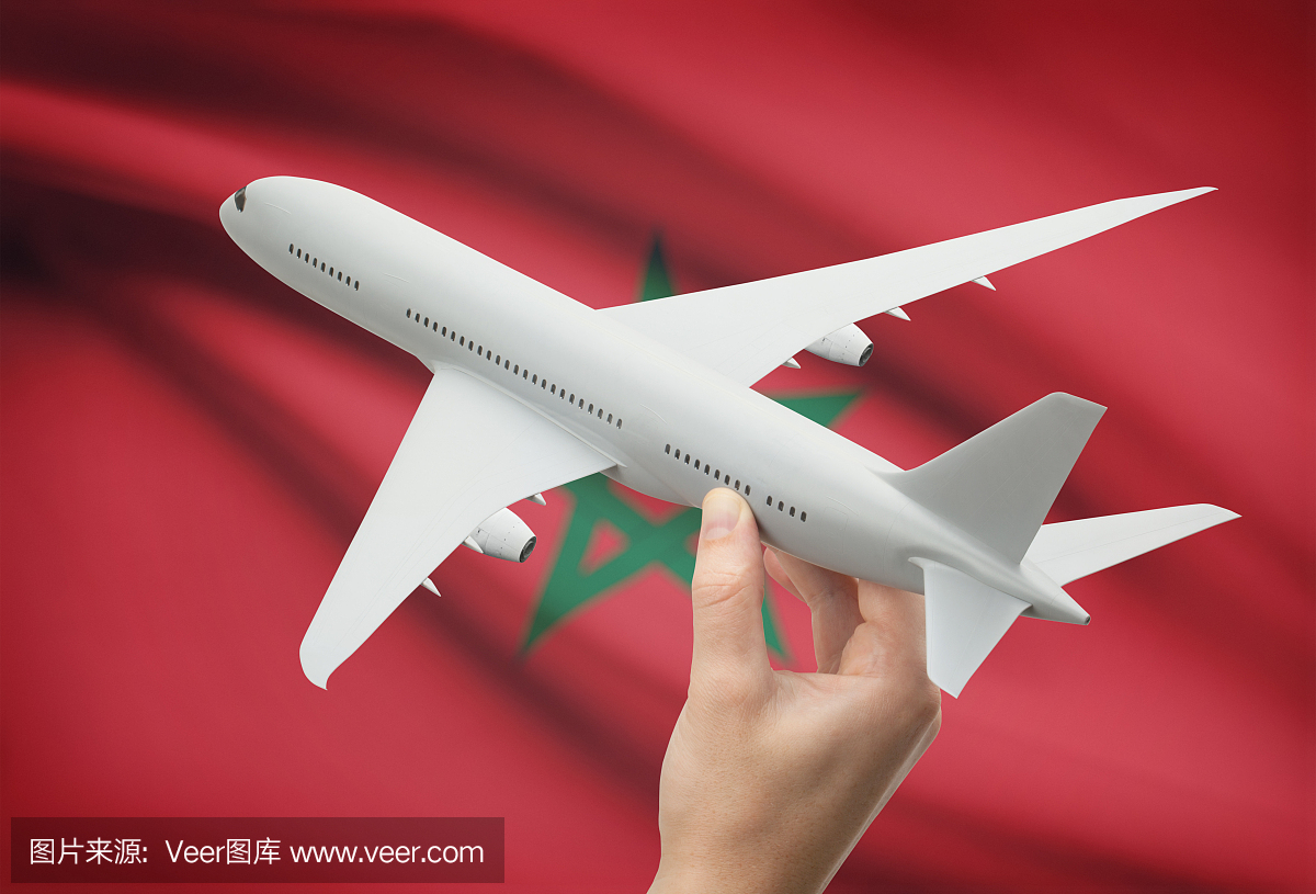 飞机在手上与国旗在背景 - 摩洛哥
