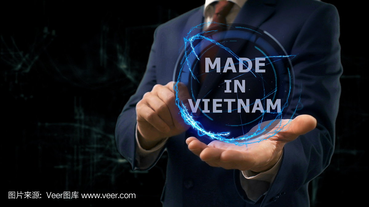 商人在他的手上显示在越南制造的概念全息图