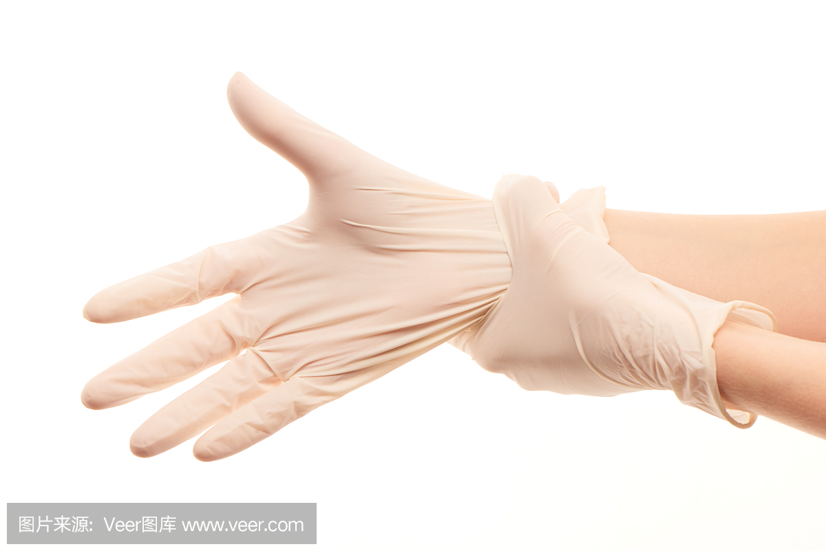 女医生的手戴上白色无菌手术手套