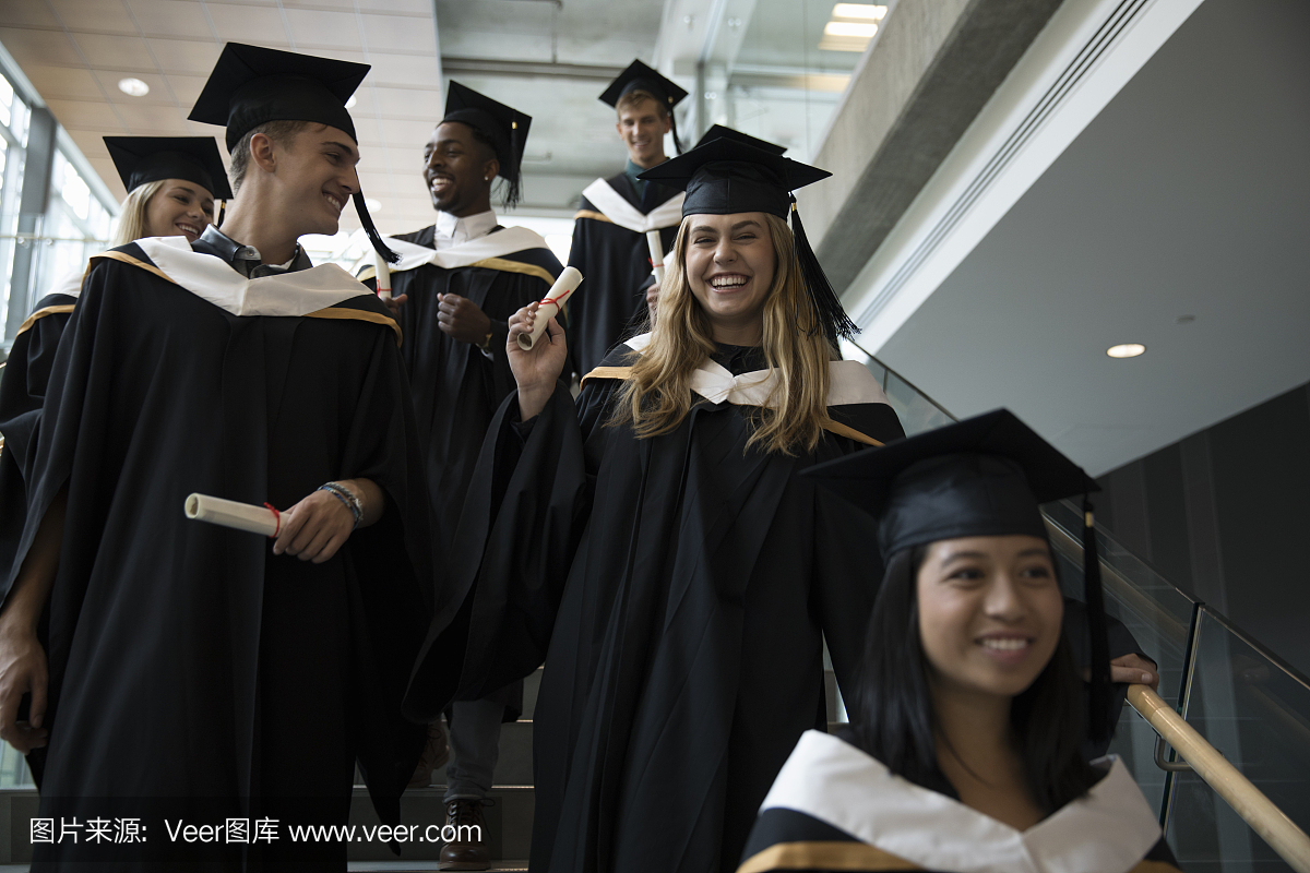 Smiling, confident college student graduates in