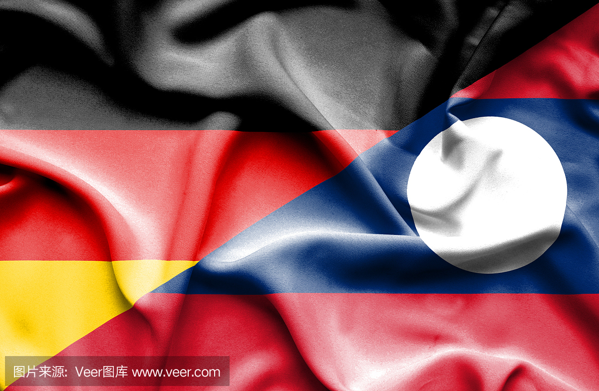 挥舞着老挝和德国的旗帜