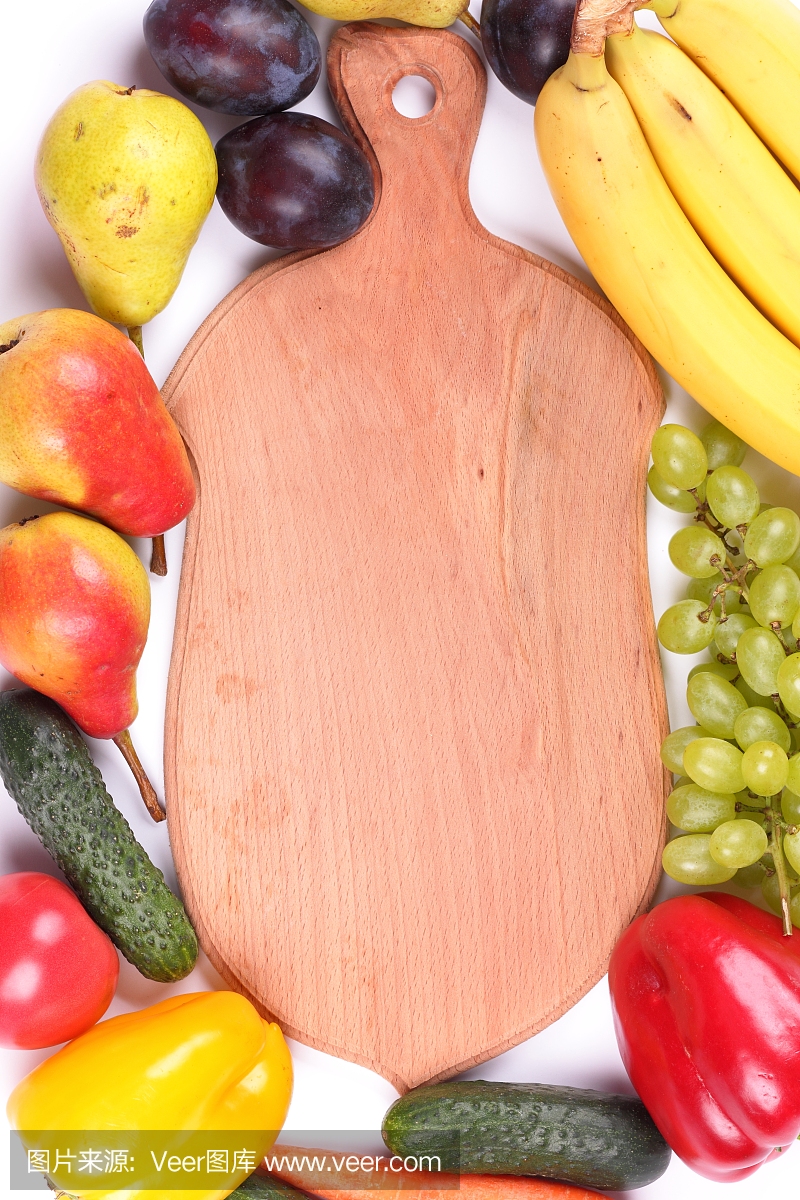 Fruits and vegetables on a wooden background