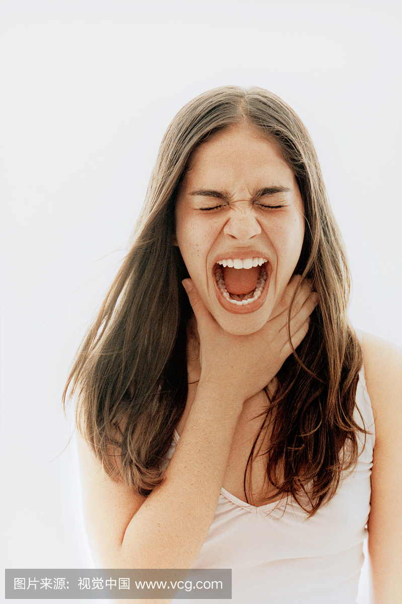 Young Woman Holding Her Hand over Throat a