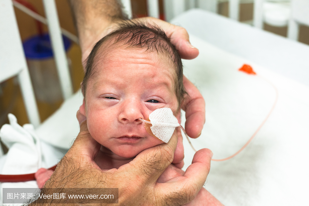 e neonatal intensive care unit being examined b
