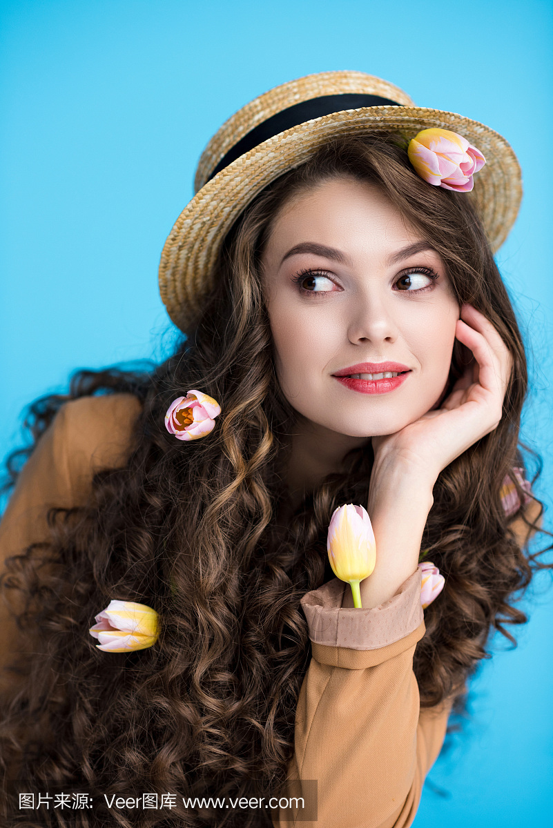 thoughtfulyoungwomanincanotierhatwithtulip图片扎半丸子头长发图片