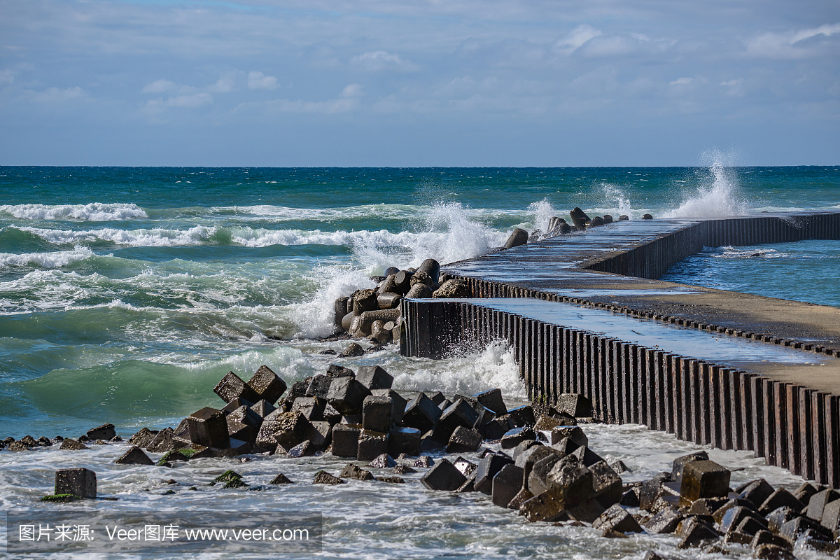 The waves beating the breakwater